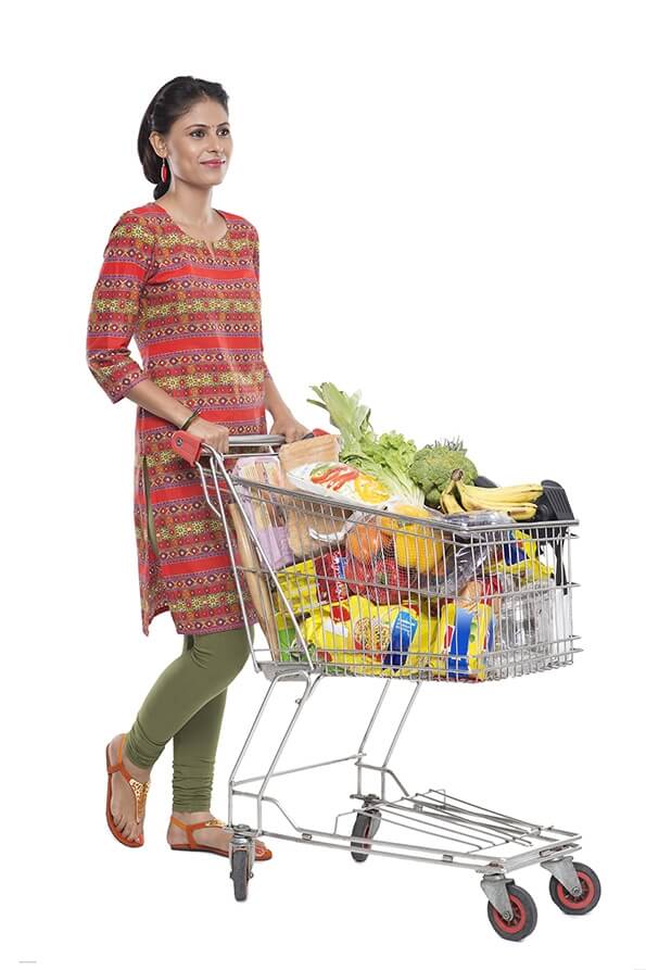 Indian woman posing with shopping kart