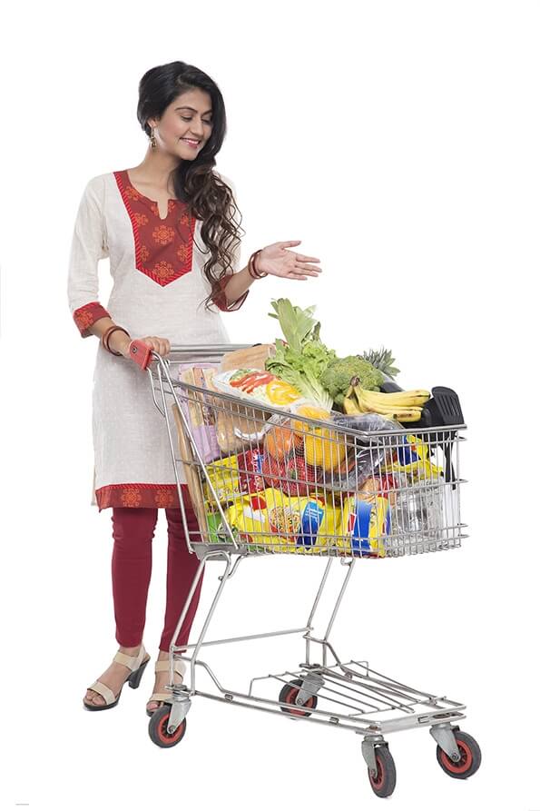Indian woman posing with shopping kart