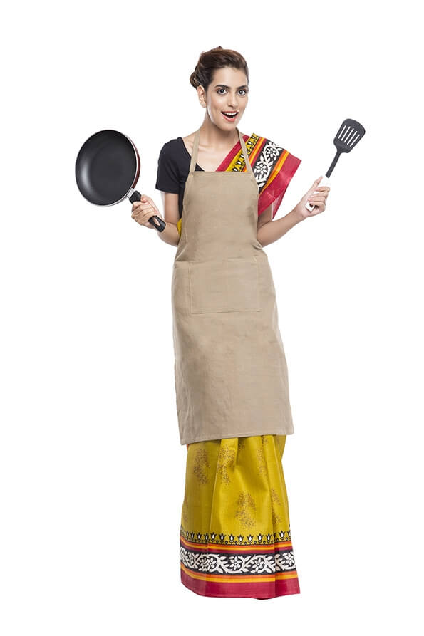 women wearing apron with kitchen utensils
