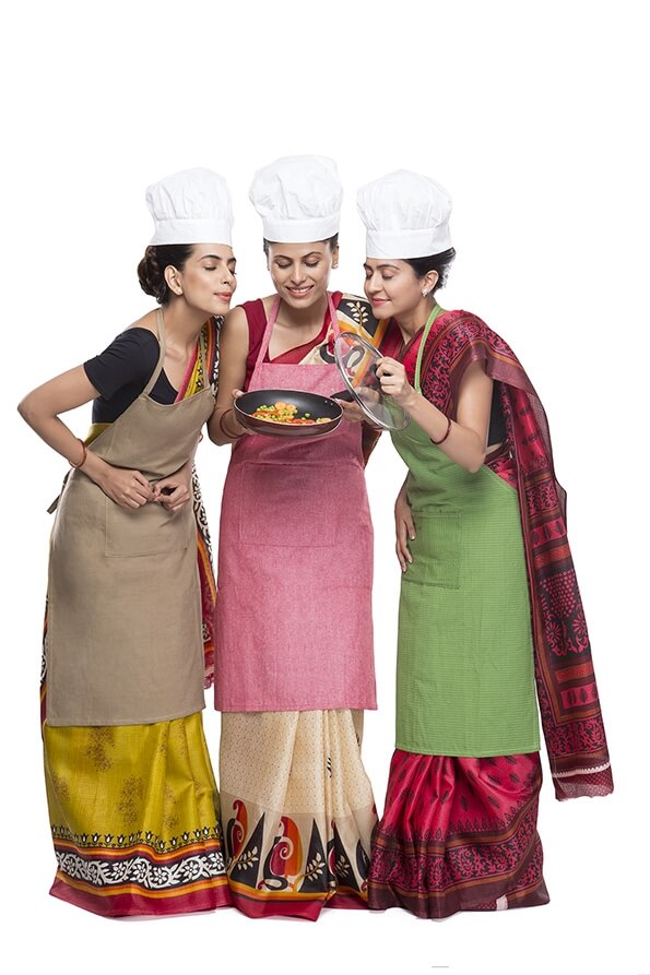 three women with fry pan