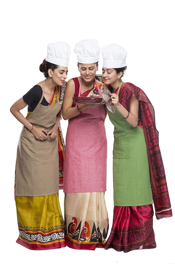 three women with fry pan