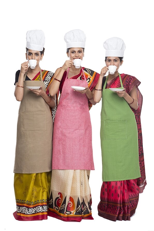 woman chef wearing apron with drink tea