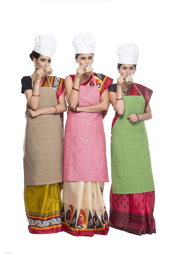 woman chef wearing apron with drink tea