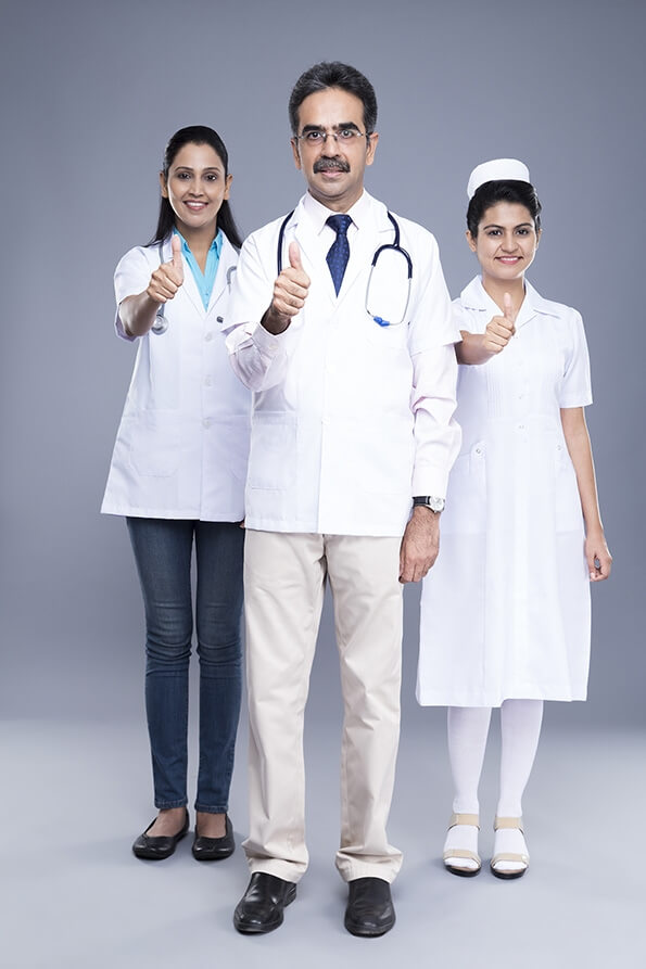 doctor with medical staff smile & thumbs