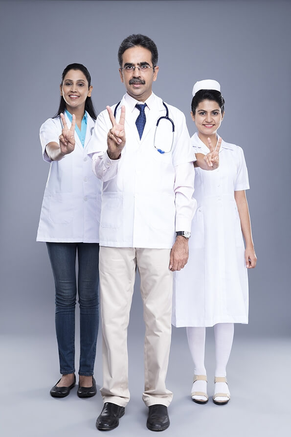 doctor with medical staff smile & victory sign