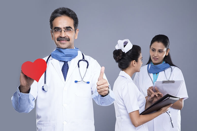 doctor right hand love hearts behind medical staff