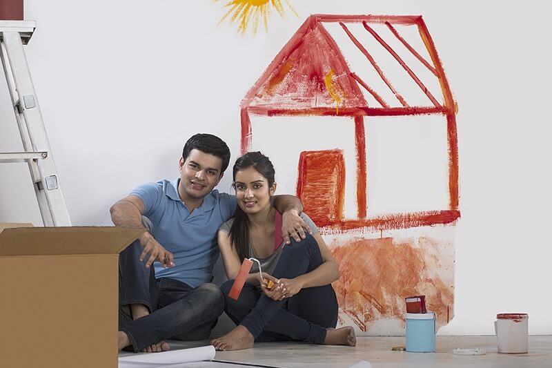 couple painting her home