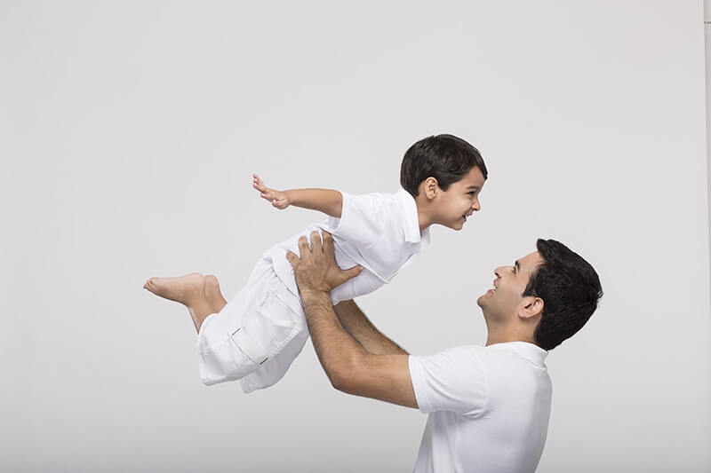 father holds his son on sky