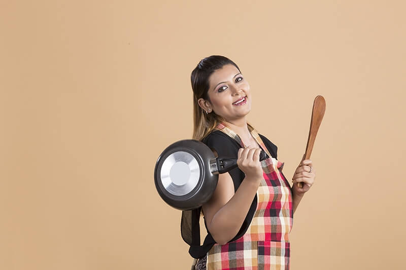 Lady as a cook in a kitchen