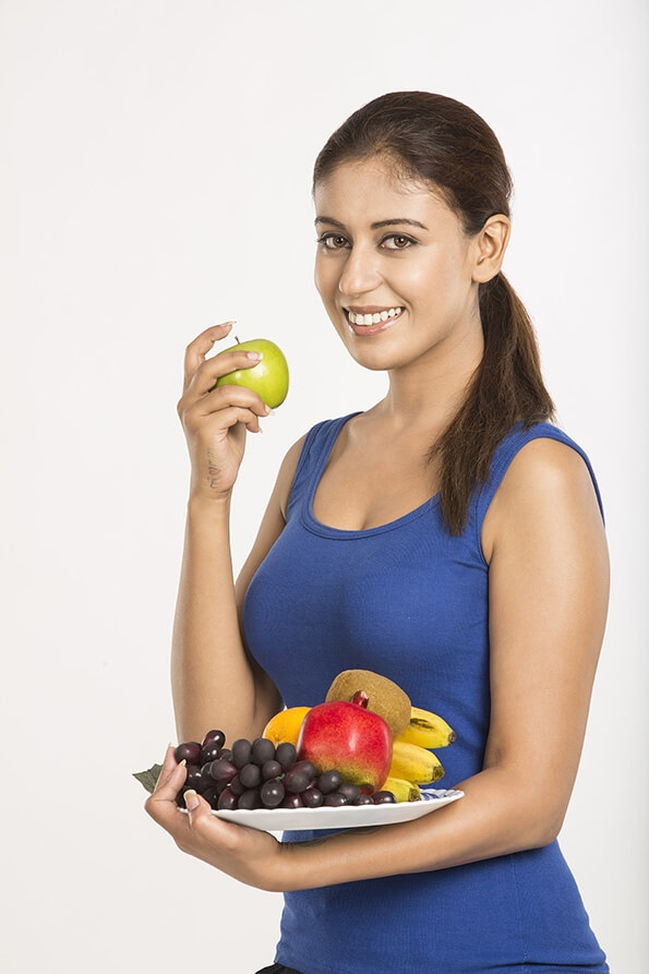 young woman with fruits