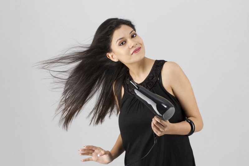 model posing with hair dryer