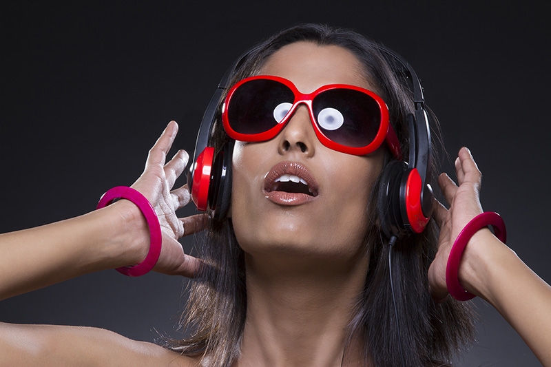 Stylish young girl listening to music
