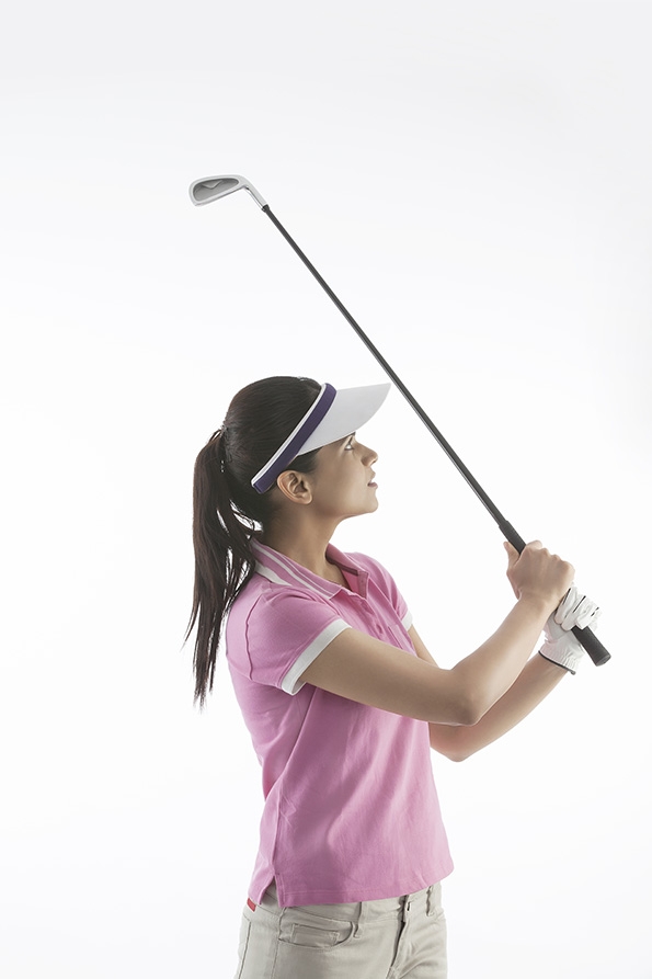 The young woman playing golf
