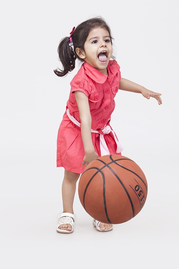 Girl Playing with basketball
