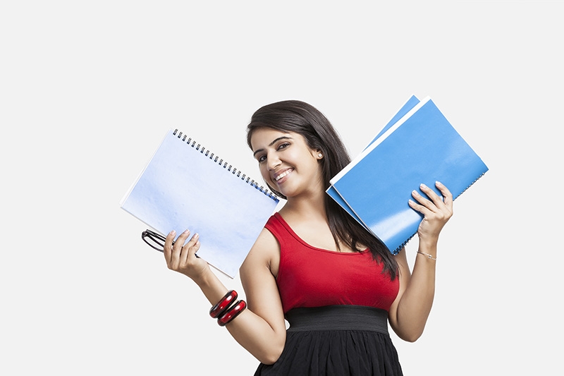 college girl posing while holding a folder